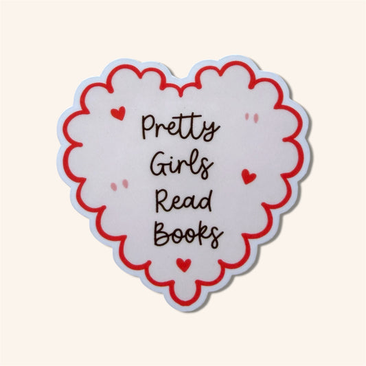 Heart-shaped sticker with 'Pretty Girls Read Books' text on a white background