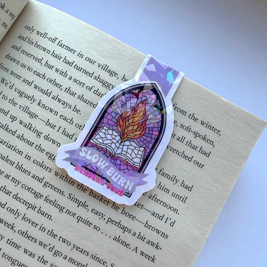 Sticker with a stained glass design and 'Slow Burn' text on a book page.